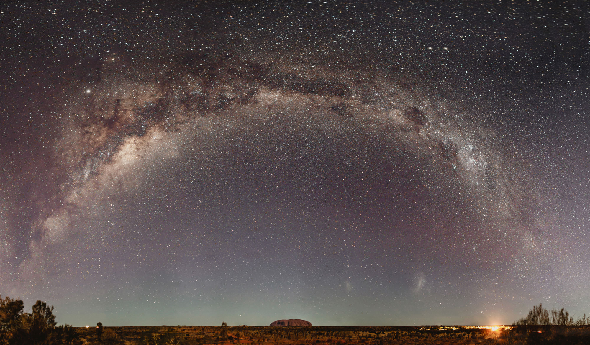 Uluru under the milky way of stars