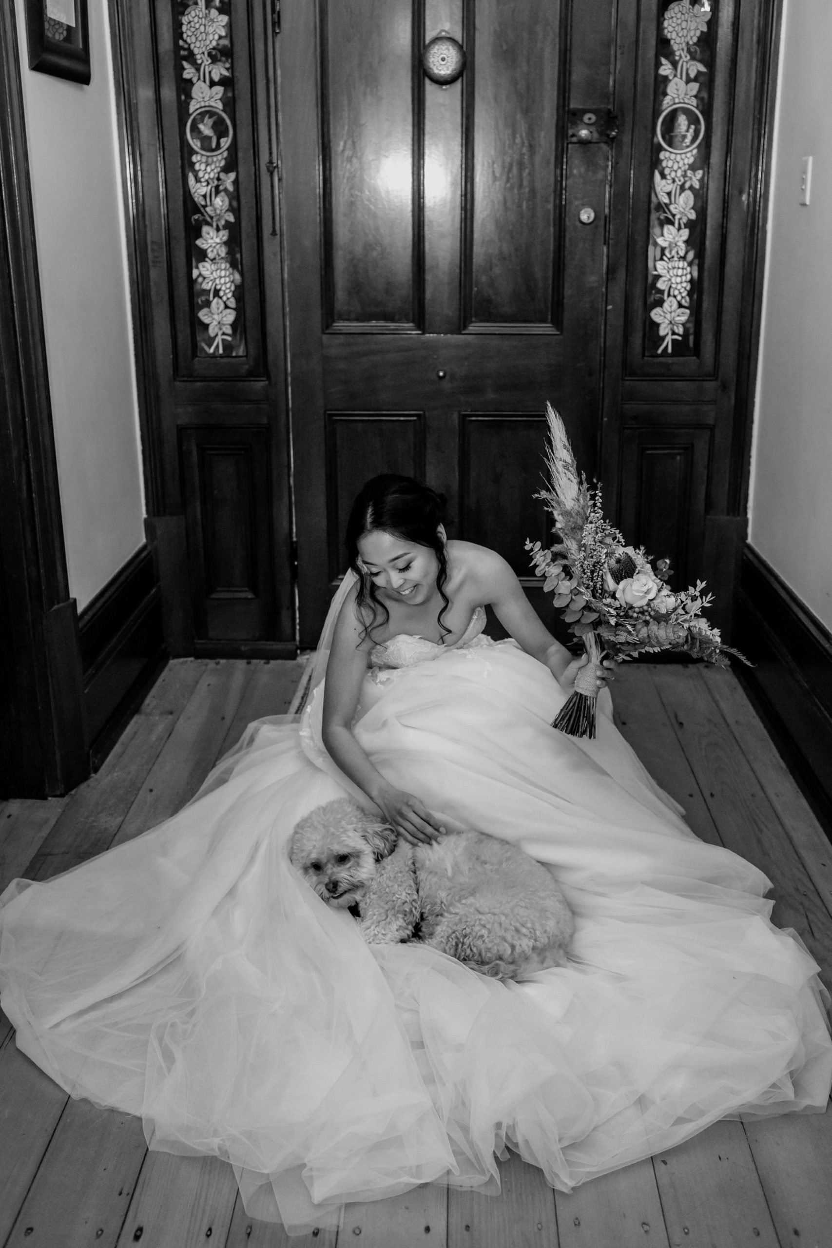 dog resting on wedding dress